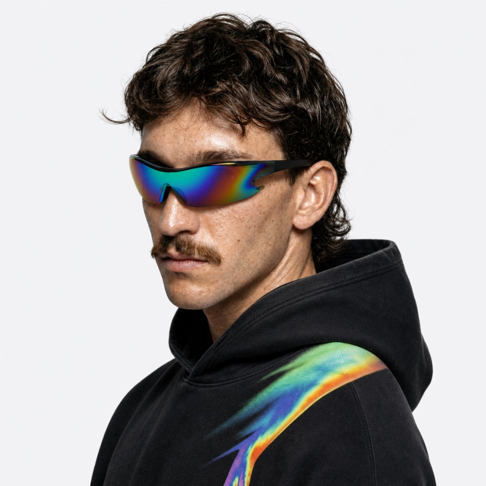 Person wearing a black hoodie with rainbow design and VYSER Sunglasses with colorful lens and black frame on a white background