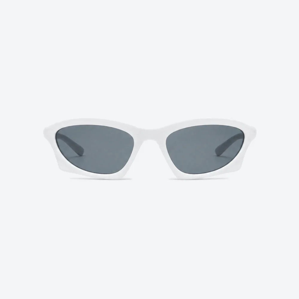 VYSER white cat-eye sunglasses with sleek matte frames and dark gray lenses, modern streetwear style.