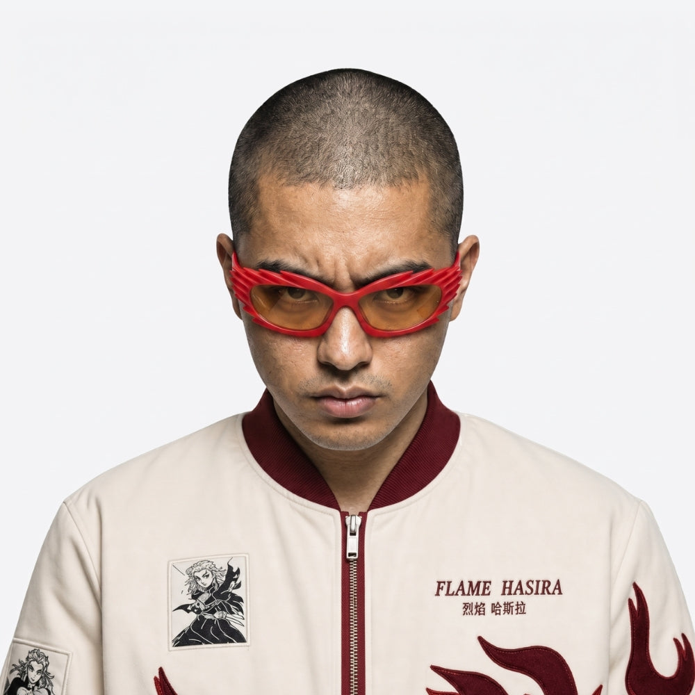 Person wearing a stylish jacket with 'FLAME HASIRA' branding and VYSER Red sunglasses with unique frame design on a white background
