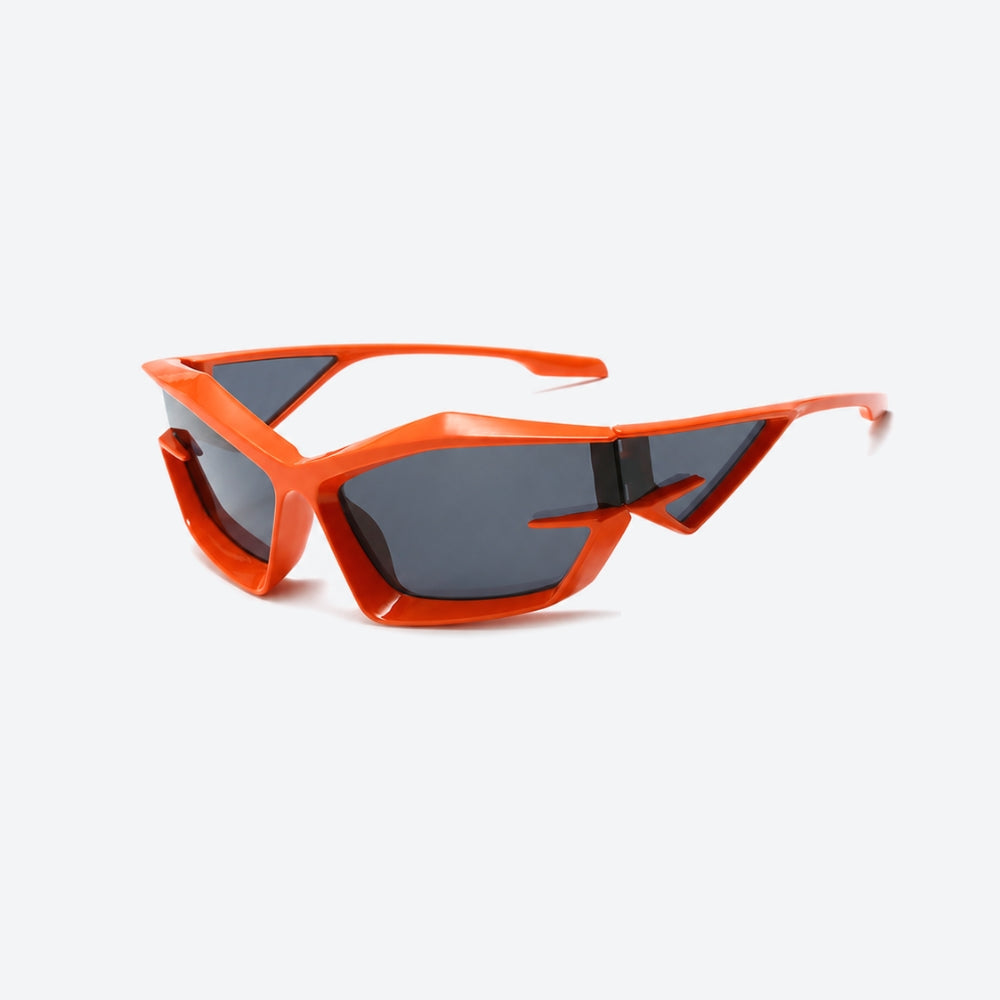 VYSER Orange sunglasses with dark lenses on a white background