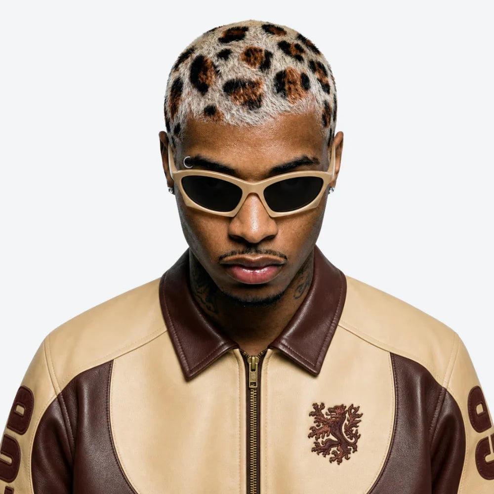 VYSER beige cat-eye sunglasses with sleek frame, paired with two-tone leather jacket and bold leopard hair.