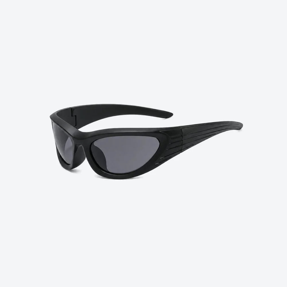 VYSER Black wrap-around shield sunglasses with dark gray lenses, shown from a three-quarters angle on a light gray background.