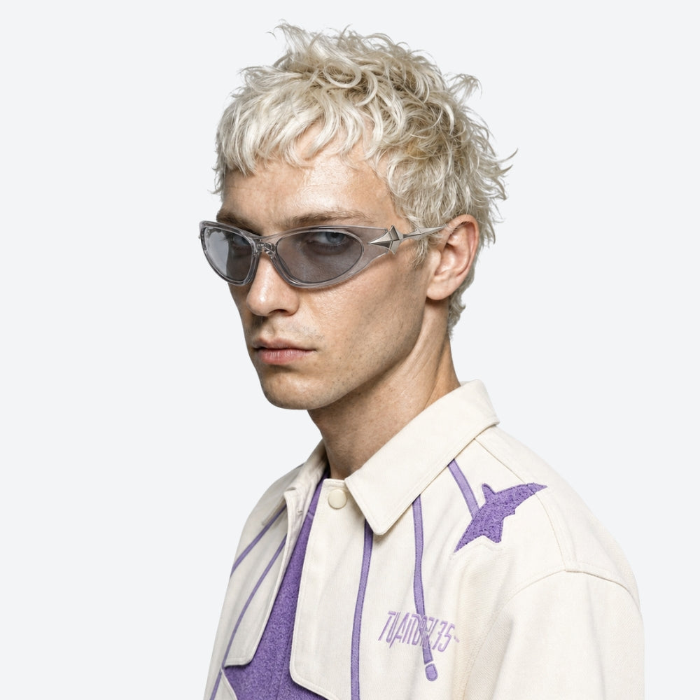 Person with blonde hair wearing VYSER Sunglasses with unique STAR design on a white background