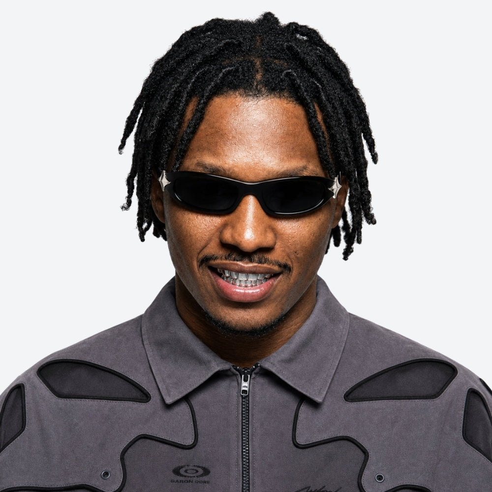 Man wearing VYSER Sunglasses with unique STAR design on a white background