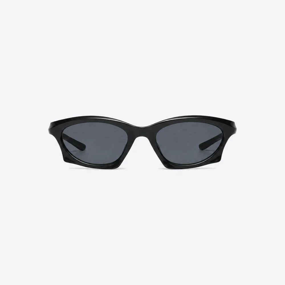 VYSER black cat-eye sunglasses with sleek frame and dark gray lenses, modern streetwear style.