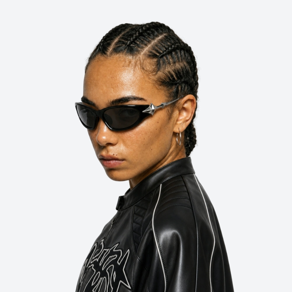 Person wearing VYSER Sunglasses with unique STAR design on a white background