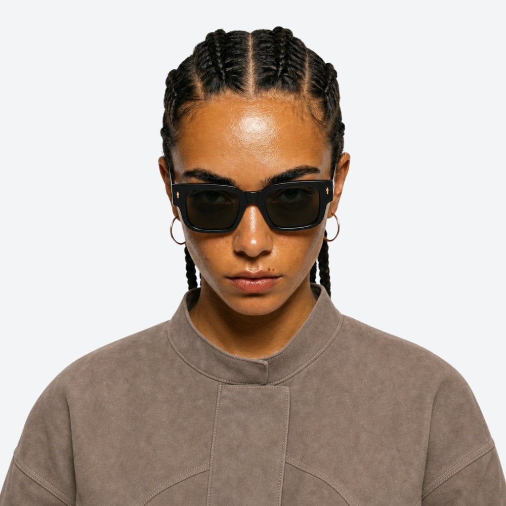 Person wearing VYSER Sunglasses with tortoiseshell arms on a white background