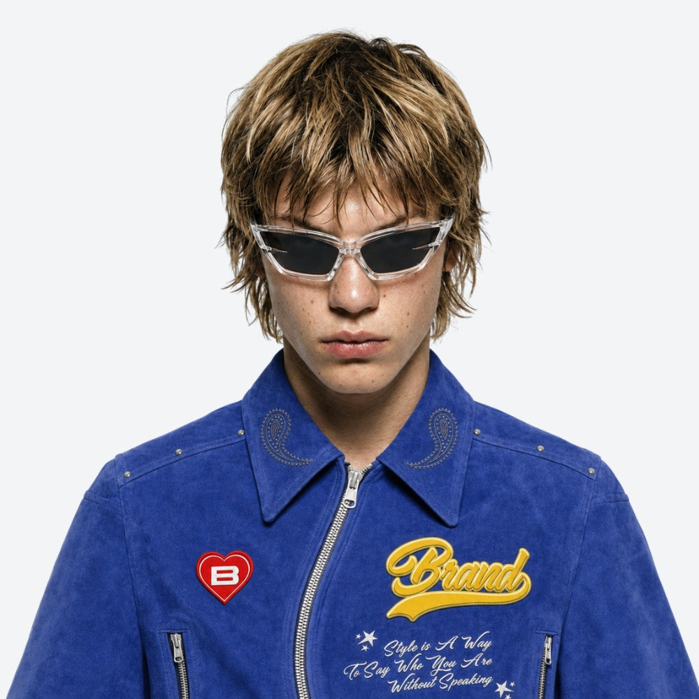 Person wearing a blue jacket with branding and VYSER Clear sunglasses with dark lenses on a light gray background