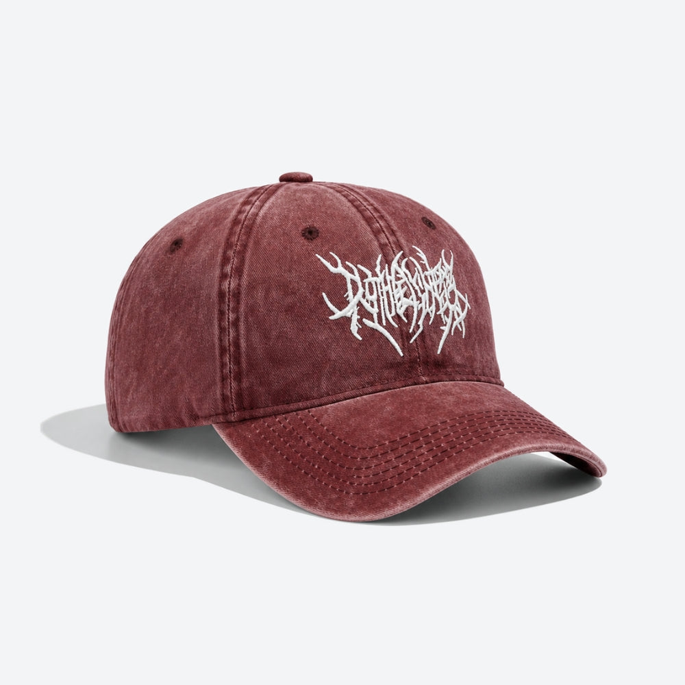 A washed maroon baseball cap with a white stylized logo embroidered on the front, displayed on a clean light gray background.