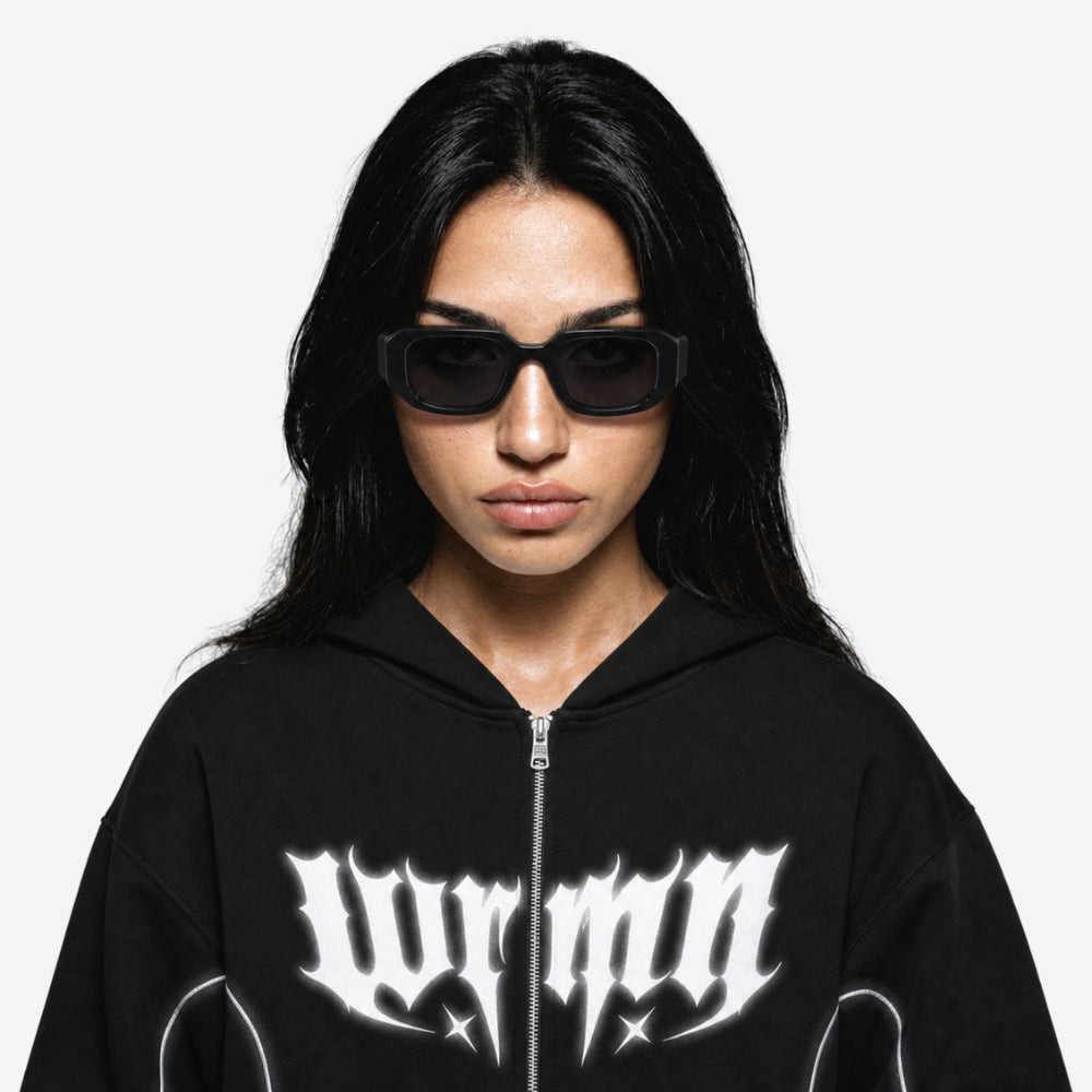 Person wearing a VYSER Black sunglasses with a white background