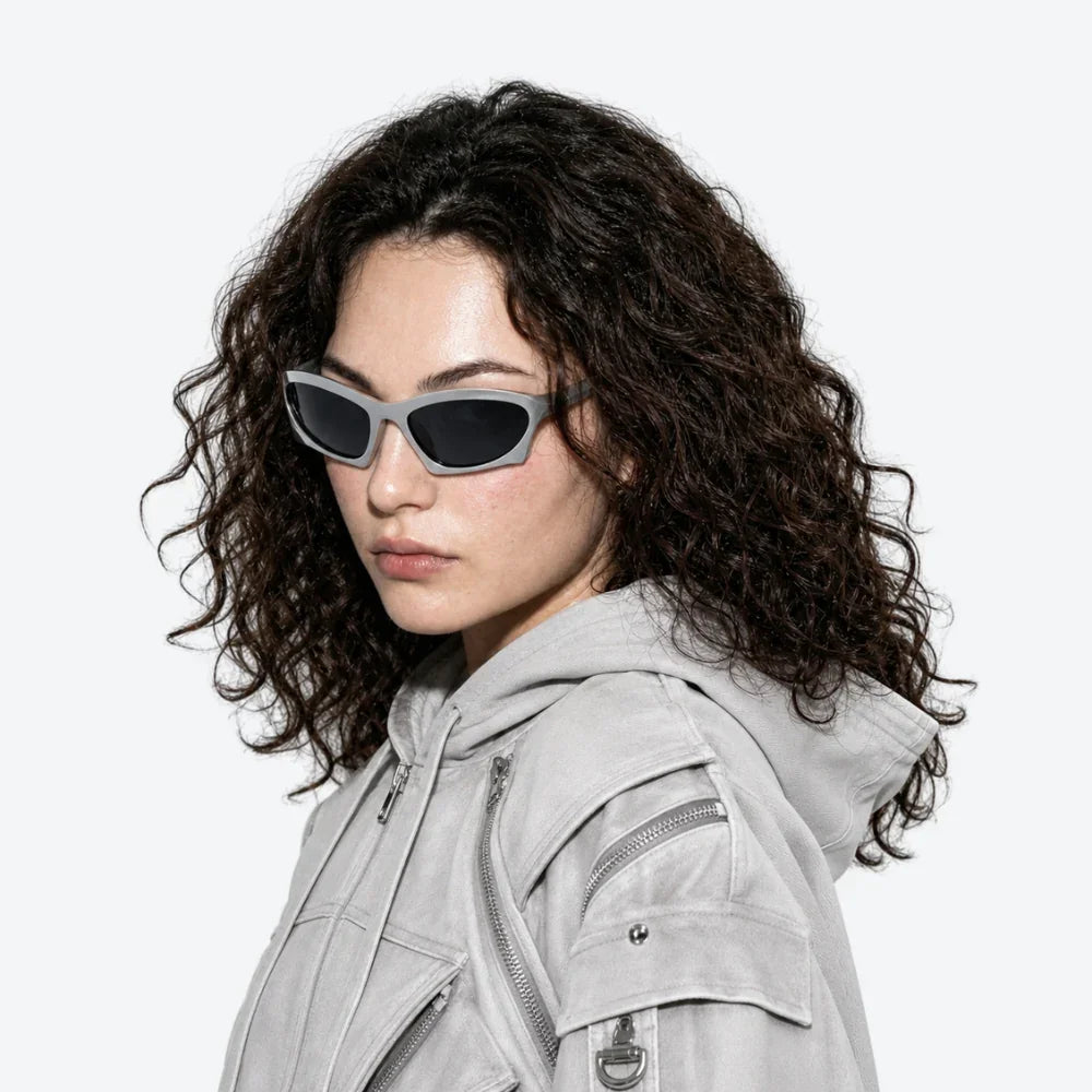 VYSER sleek gray cat-eye sunglasses with black lenses, styled with a matching utility hoodie for modern streetwear vibes.