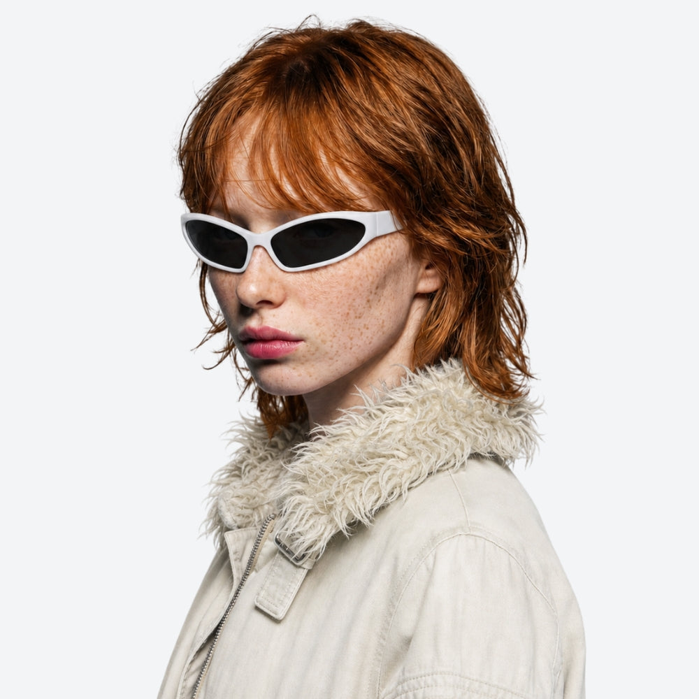 Person wearing white VYSER sunglasses and a beige coat with a fur-lined hood on a white background