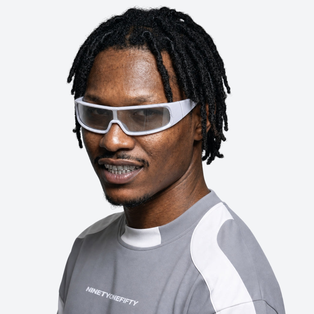 Man wearing futuristic VYSER White sunglasses on a white background