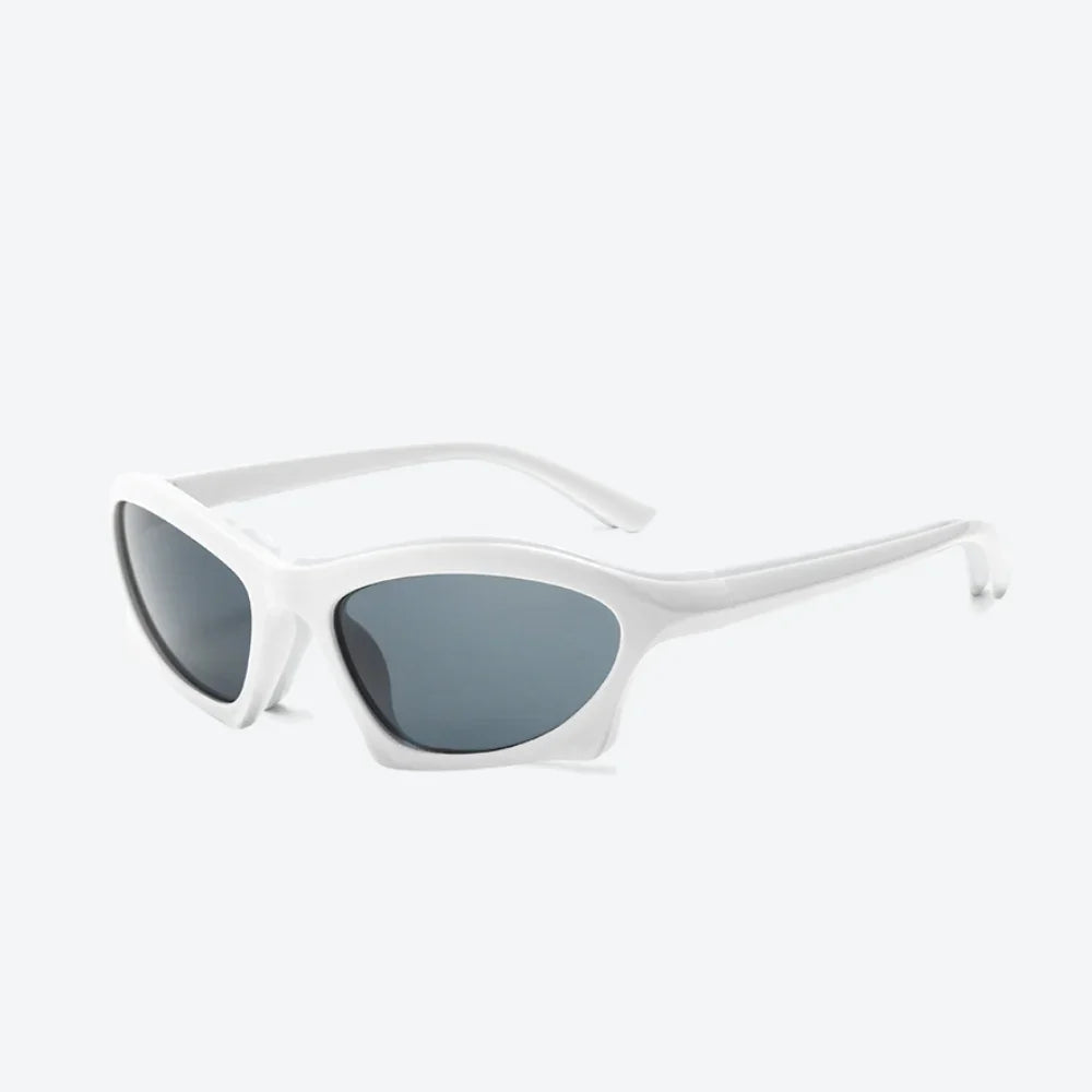 VYSER white cat-eye sunglasses with sleek frame and dark gray lenses, modern streetwear style.