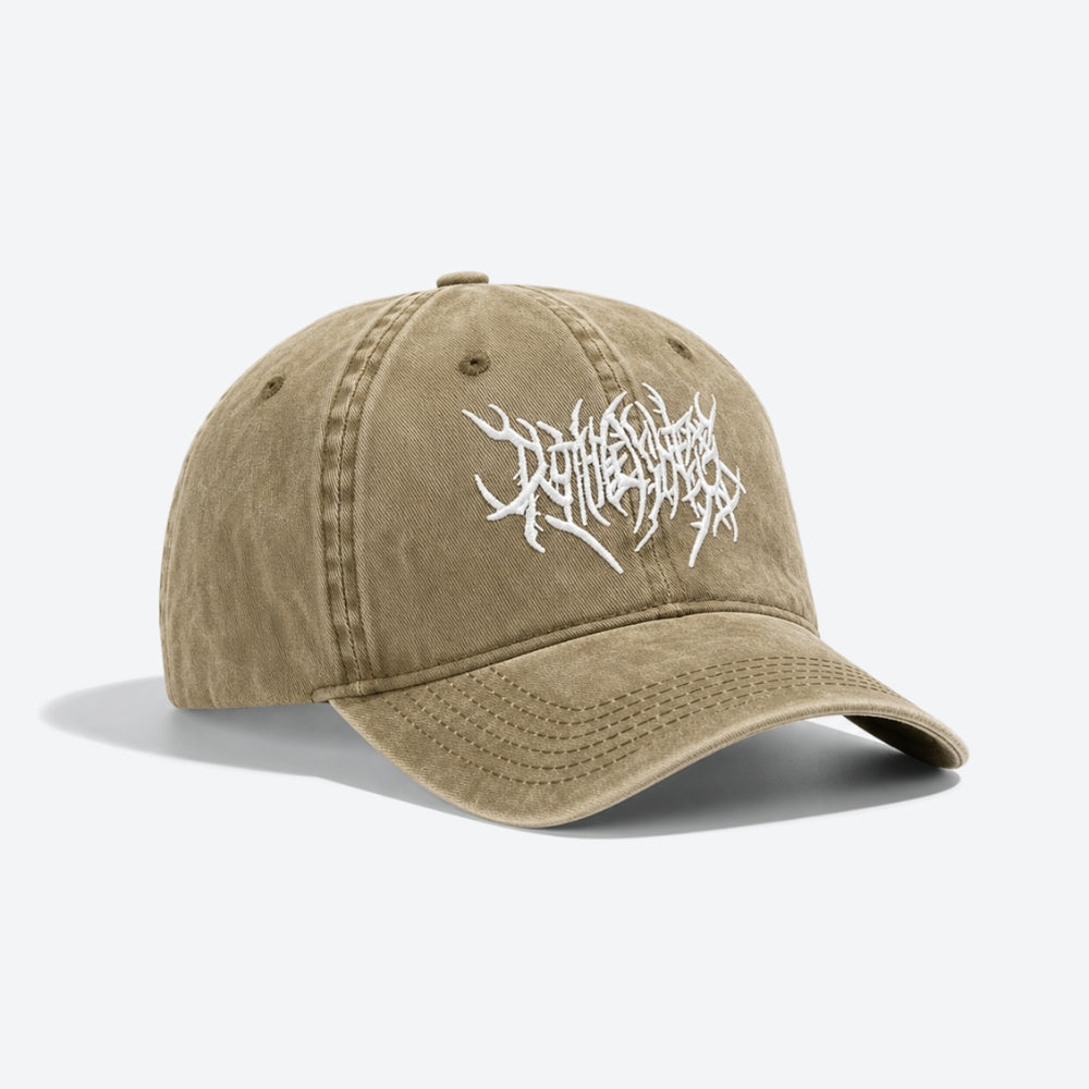 A washed khaki baseball cap with a white stylized metal-style logo embroidered on the front, shown on a light gray background.