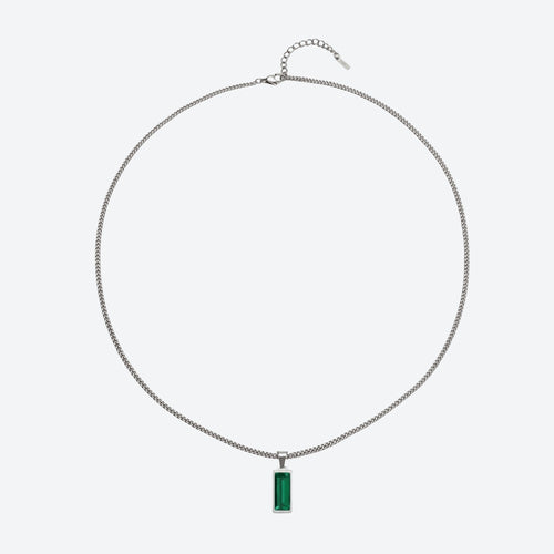 A silver-toned chain necklace with a rectangular green gemstone pendant, displayed against a light gray background.