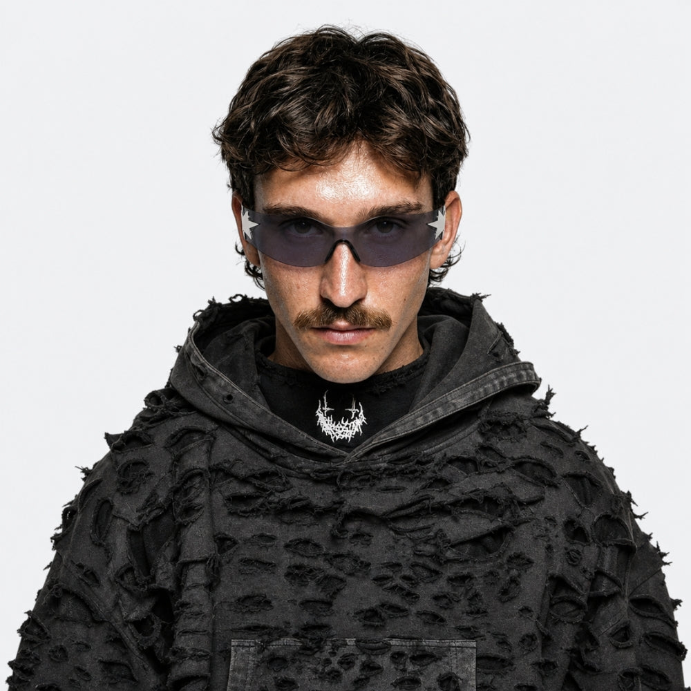 Person wearing a black textured hoodie and VYSER Sunglasses with a star design on a white background