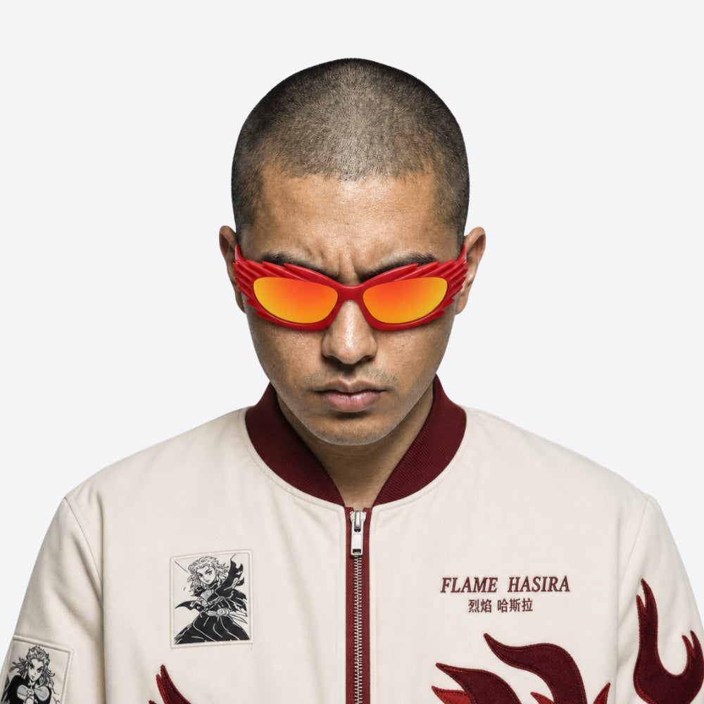 Person wearing a stylish jacket with 'FLAME HASIRA' branding and VYSER Red sunglasses with unique frame design on a white background