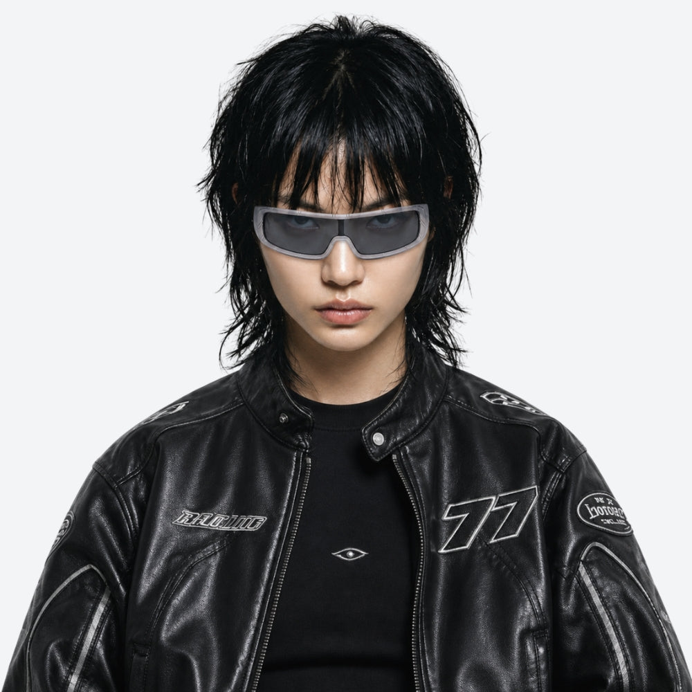Person wearing a black leather jacket with VYSER White sunglasses with dark lenses on a white background