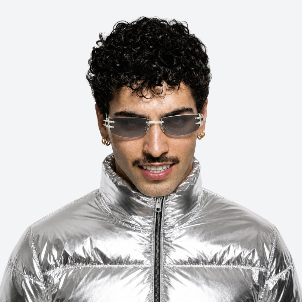 Person wearing a silver reflective jacket and VYSER Blue car door handle on a white background