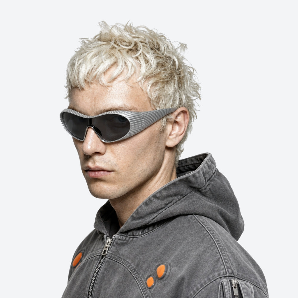Man wearing VYSER silver Sunglasses with hexagonal lenses on a white background