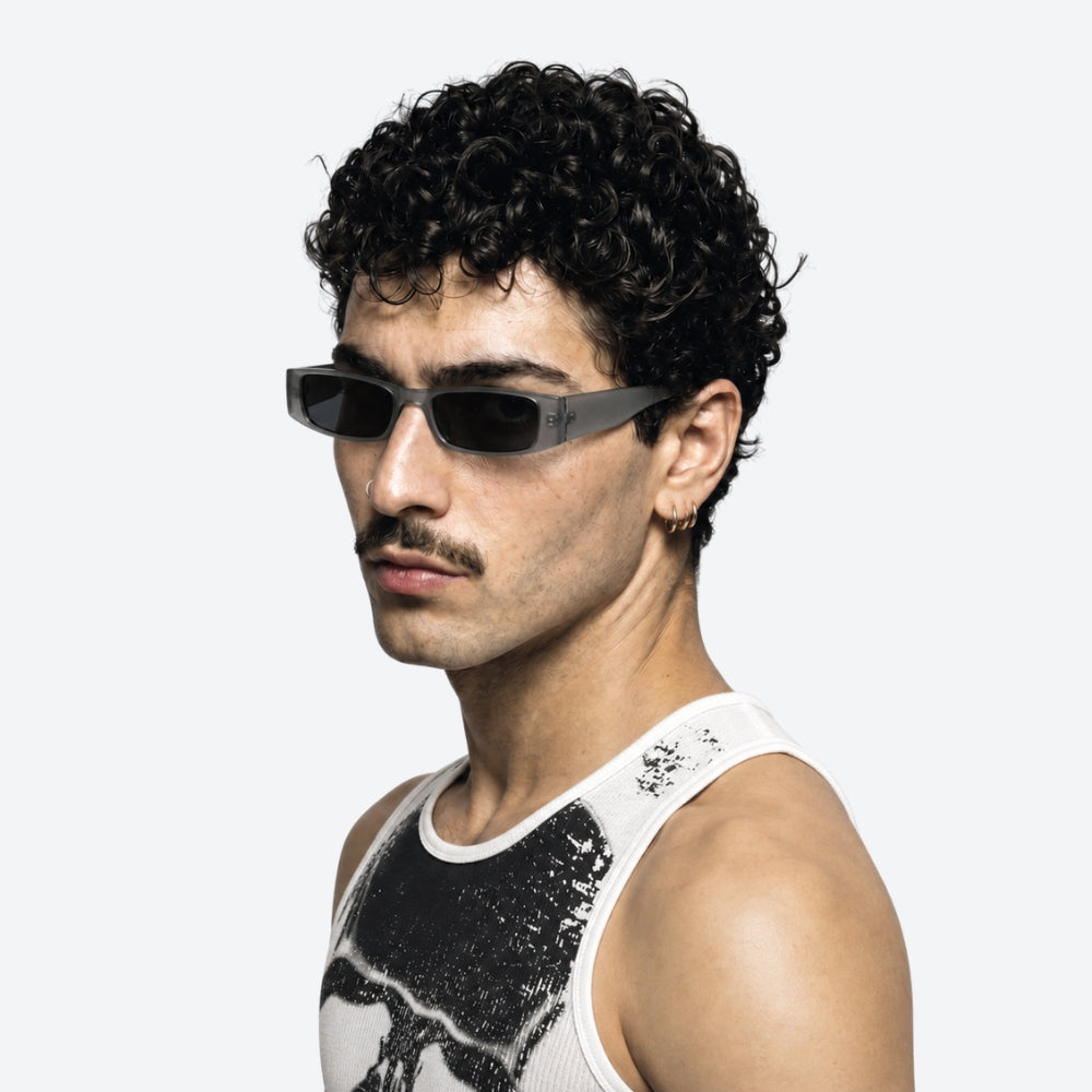 Man wearing VYSER silver transaprent frame sunglasses on a white background