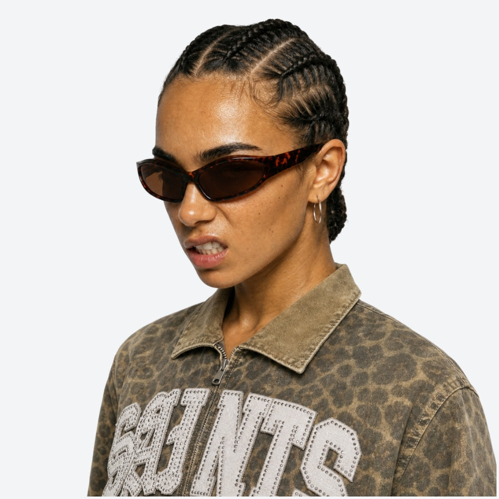 Person wearing VYSER sunglasses and a patterned shirt with 'Browns' text on a white background