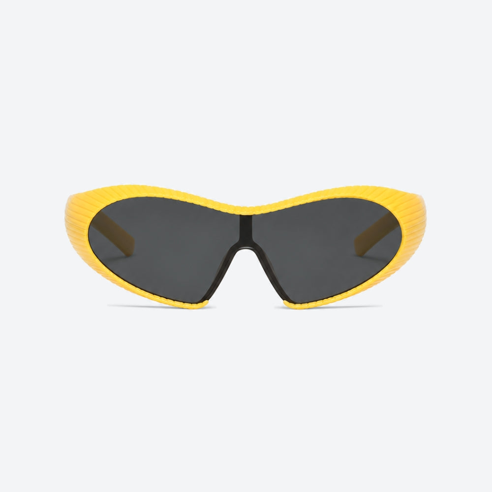 VYSER Yellow sunglasses with black lenses on a light gray background