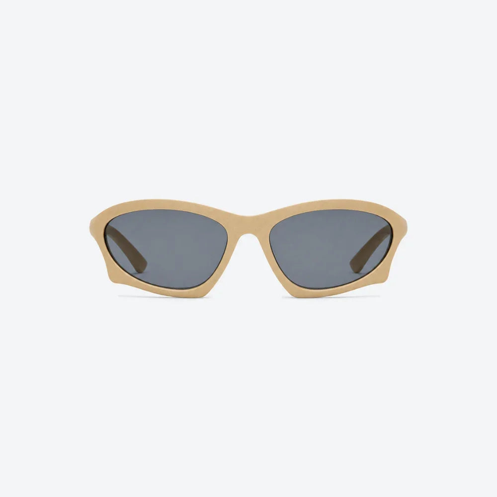 VYSER beige cat-eye sunglasses with matte finish and dark gray lenses, modern streetwear style.