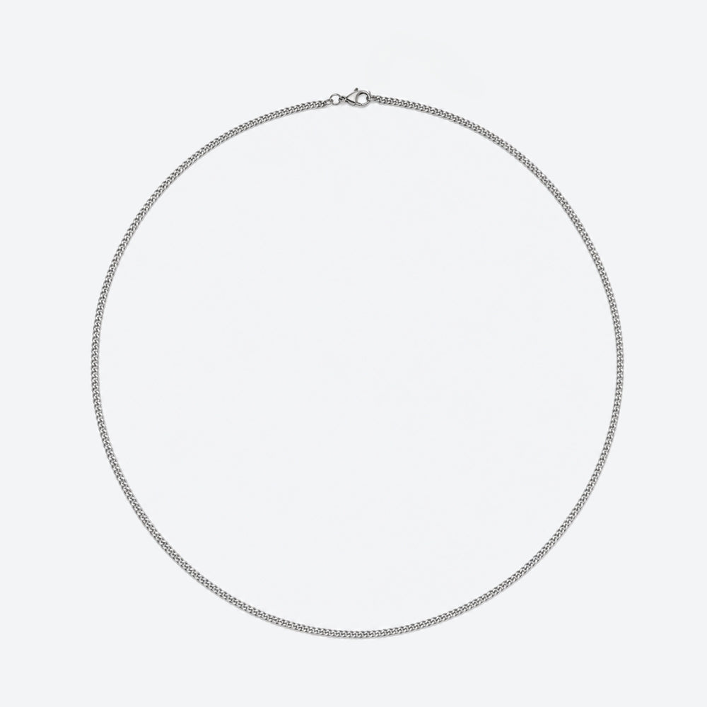 A silver chain necklace with a small lobster clasp, displayed in a circular shape against a plain light gray background.