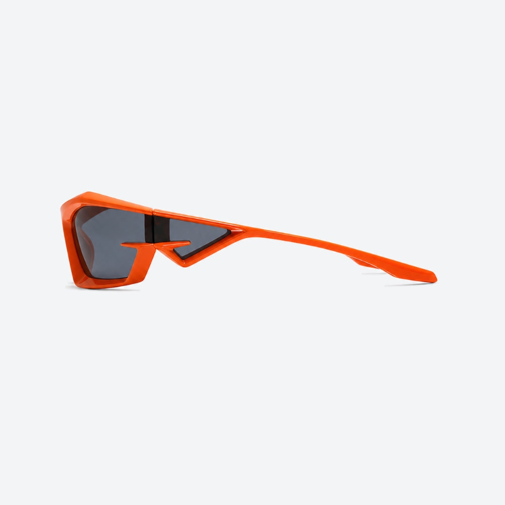 VYSER Orange sunglasses with dark lenses on a white background