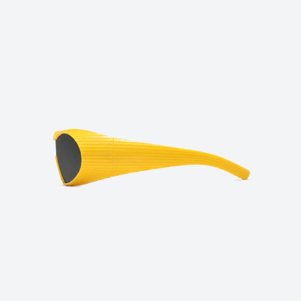 VYSER Yellow sunglasses with black lenses on a light gray background