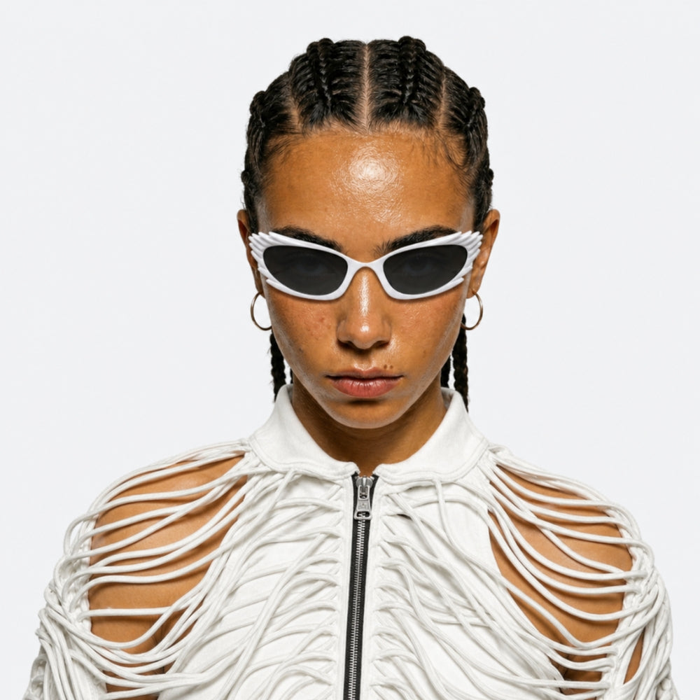 Person wearing VYSER White sunglasses with dark lenses on a white background