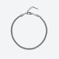 SILVER. A silver-toned Cuban curb chain bracelet with a lobster clasp and extension chain, on a light gray background.