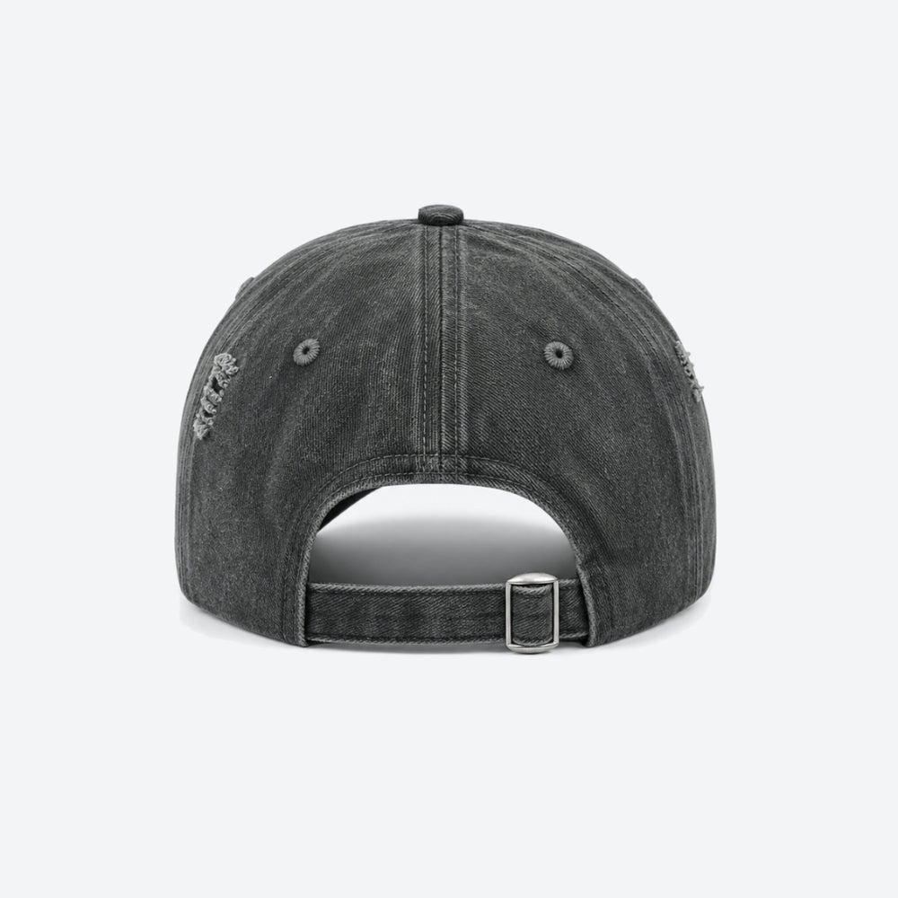 Back view of a dark grey washed baseball cap with distressed detailing and an adjustable buckle strap