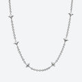 A silver chain necklace featuring five evenly spaced, polished starburst-shaped links, displayed against a clean, light gray background.