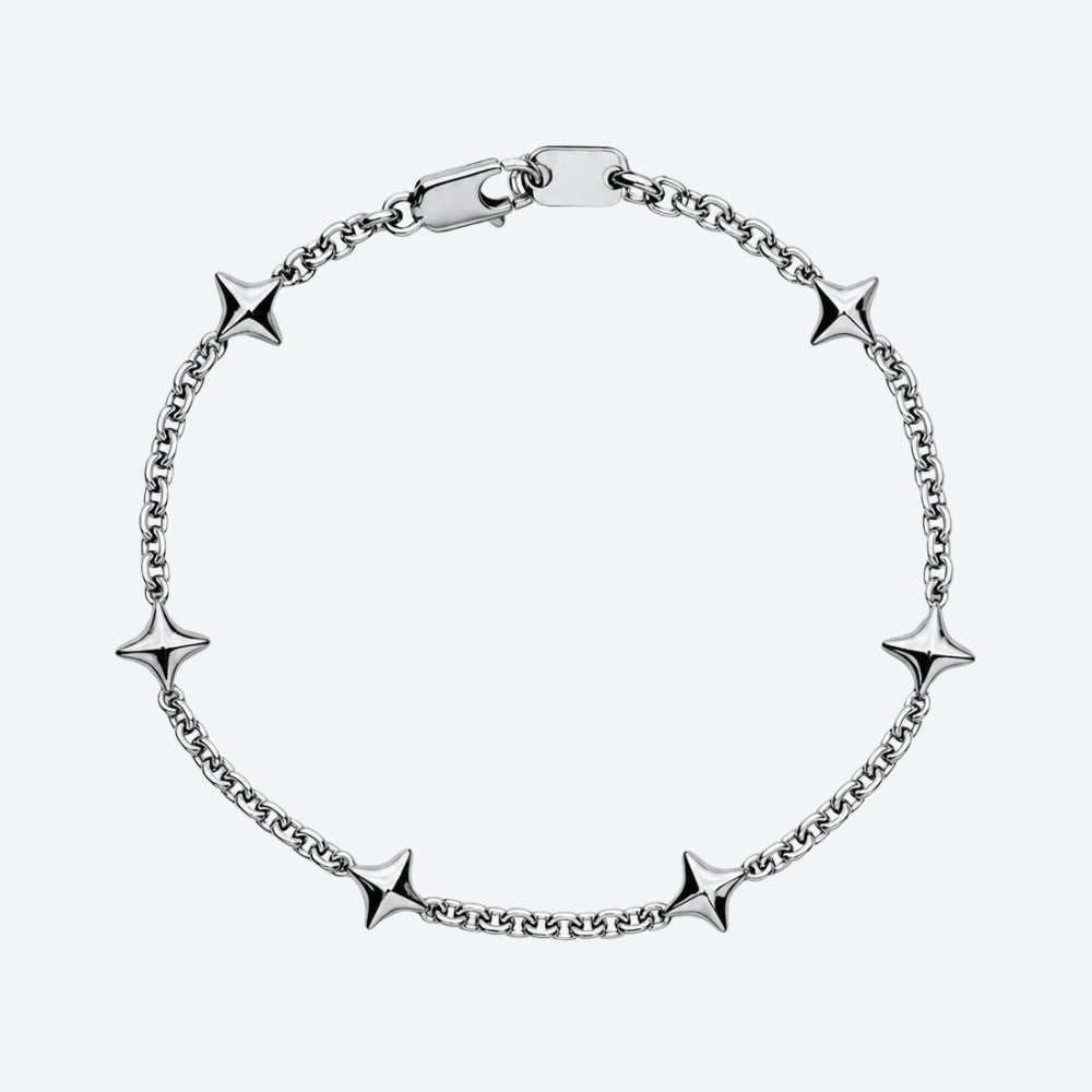 A silver chain bracelet with five star-shaped charms spaced evenly around the loop, shown on a light gray background.