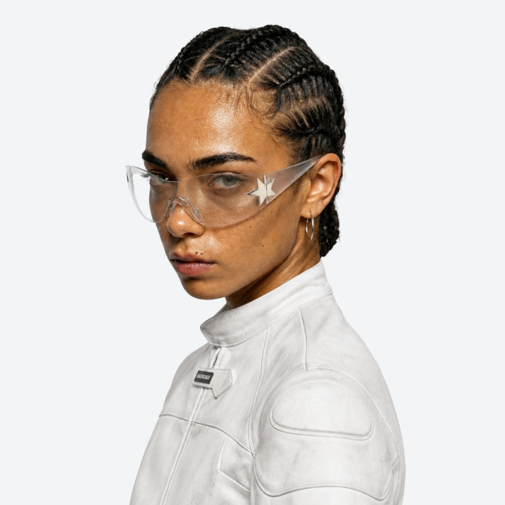 Person wearing VYSER Clear sunglasses with silver frames on a white background
