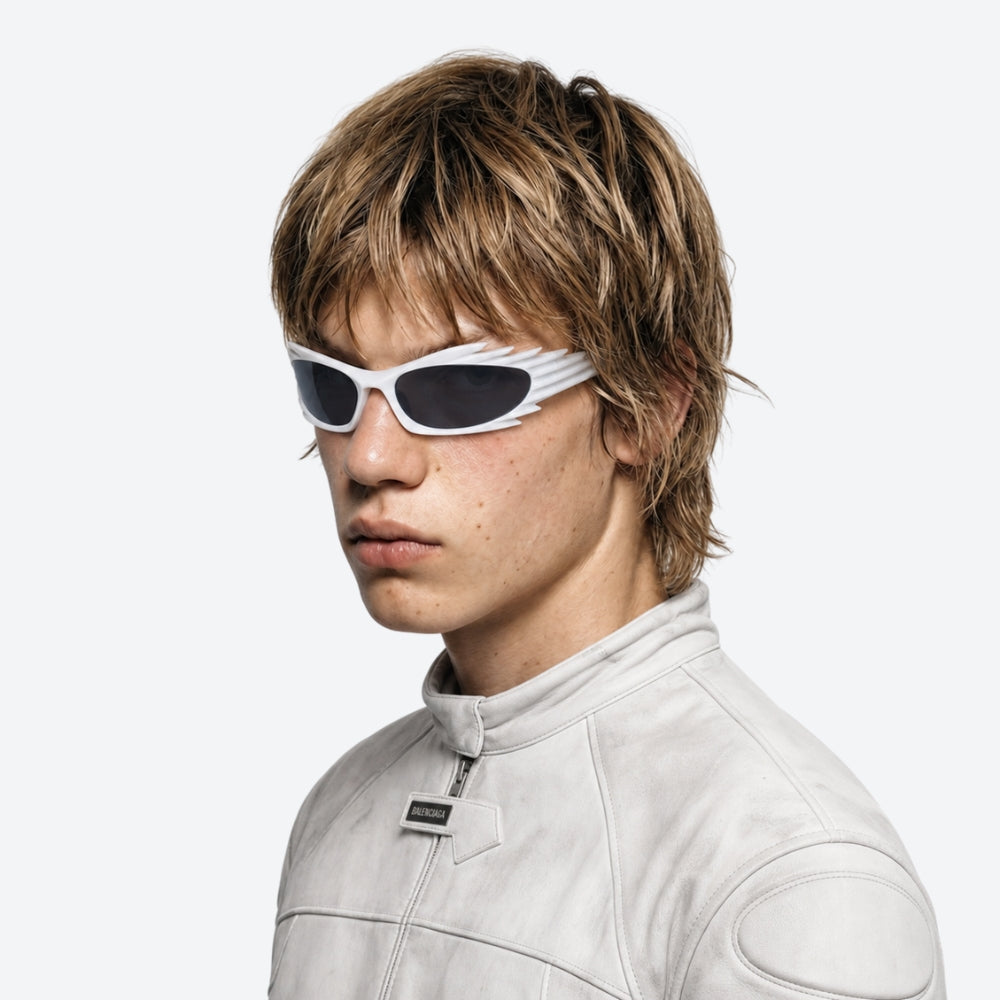 Person wearing VYSER White sunglasses with dark lenses on a white background