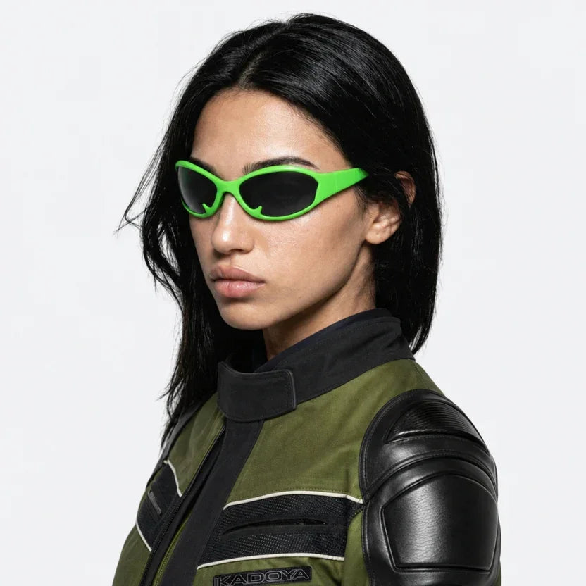 Person wearing VYSER neon green retro sunglasses with dark lenses, bold streetwear style for sunny days.