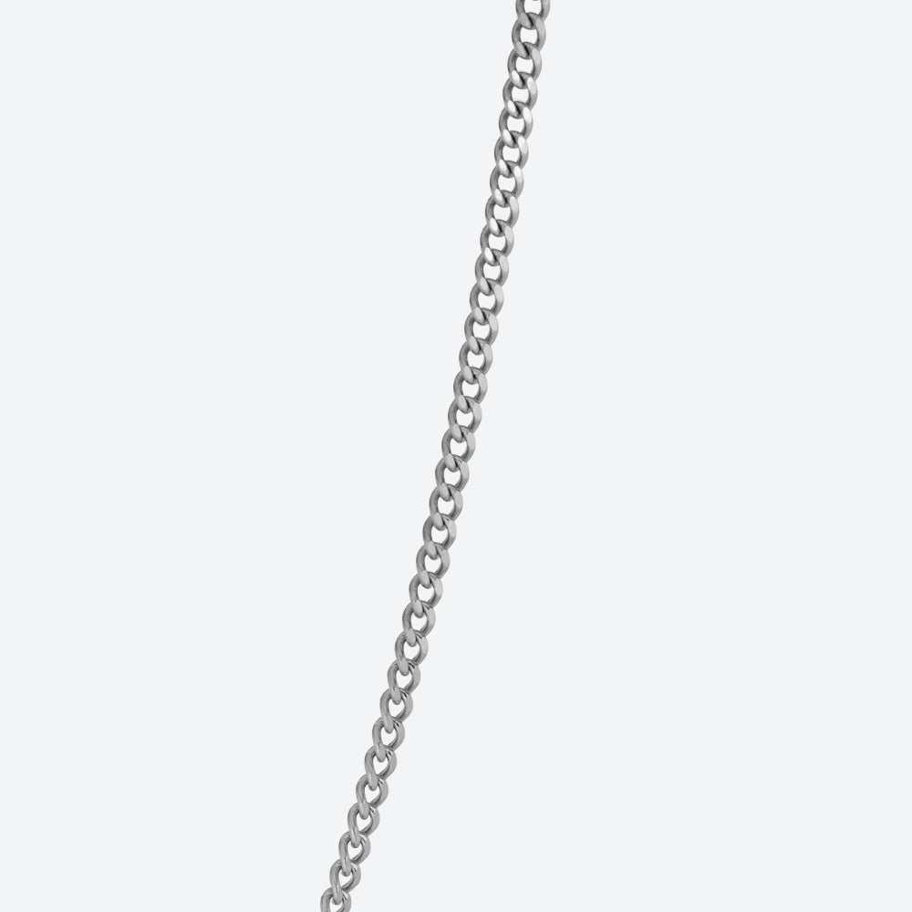 A close-up of a silver-toned metal chain running vertically down the center of a light gray background.