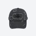 A dark gray distressed baseball cap with a central black star logo surrounded by a rough white outline, shown against a plain light gray background.