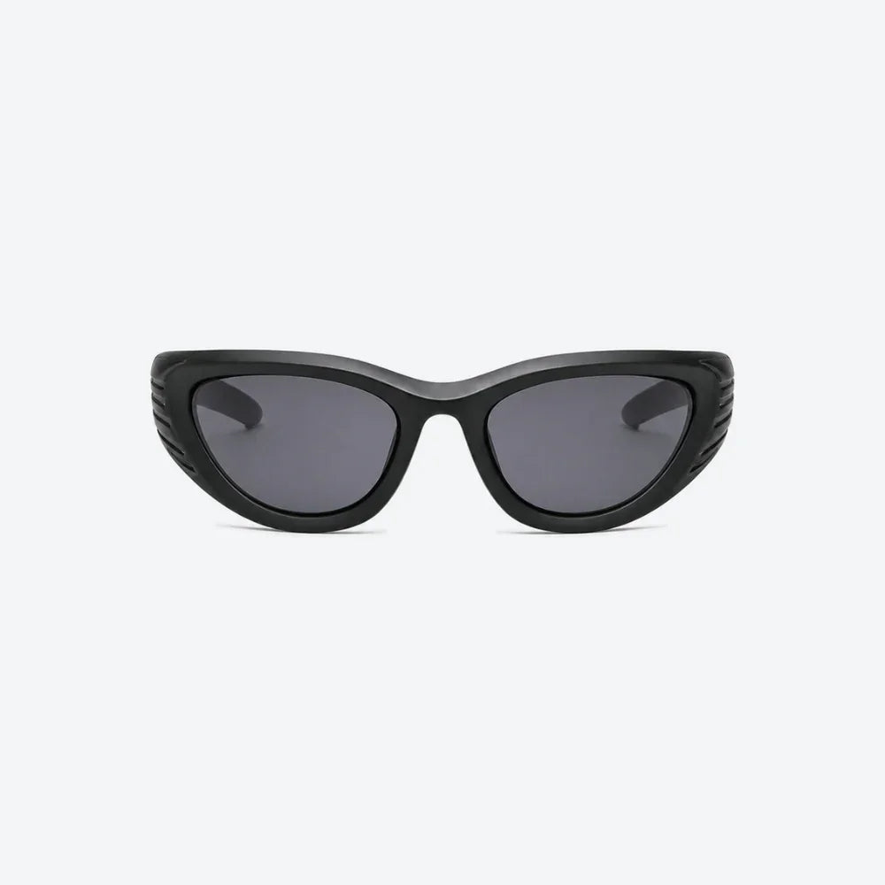 VYSER Black wrap-around shield sunglasses with dark gray lenses, shown from a three-quarters angle on a light gray background.