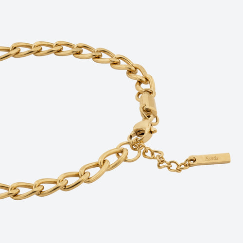 Gold-tone chain necklace with a lobster clasp, extender chain, and a small rectangular tag engraved with the brand name 'Bantle' on a light gray background.