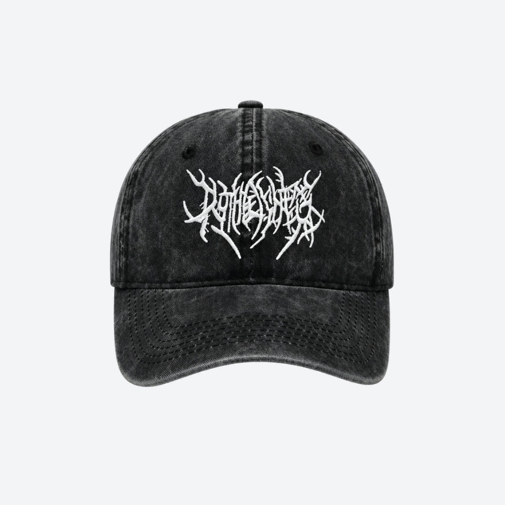 A black washed baseball cap featuring a white stylized metal logo embroidered on the front, displayed against a light gray background.
