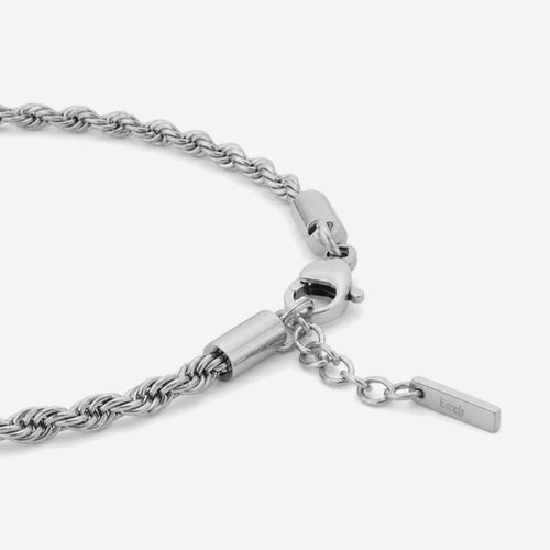 SILVER. A close-up of a silver rope chain bracelet with a lobster clasp and extension chain.