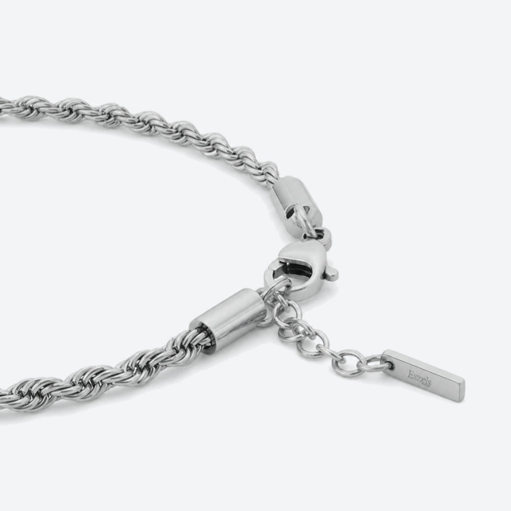 SILVER. A close-up of a silver rope chain bracelet with a lobster clasp and extension chain.