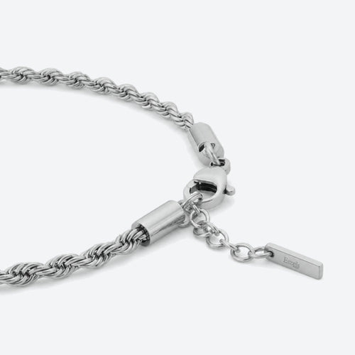 SILVER. A close-up of a silver rope chain bracelet with a lobster clasp and extension chain.