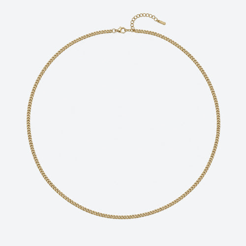 GOLD. A gold Cuban chain necklace with a curb link pattern, displayed in a circular shape against a clean light gray background.