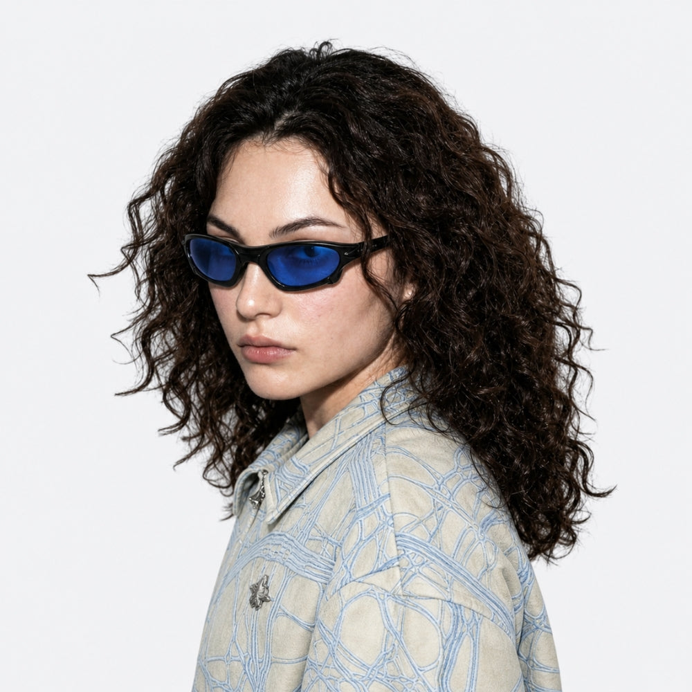 VYSER Black sunglasses with blue-tinted lenses on a white background